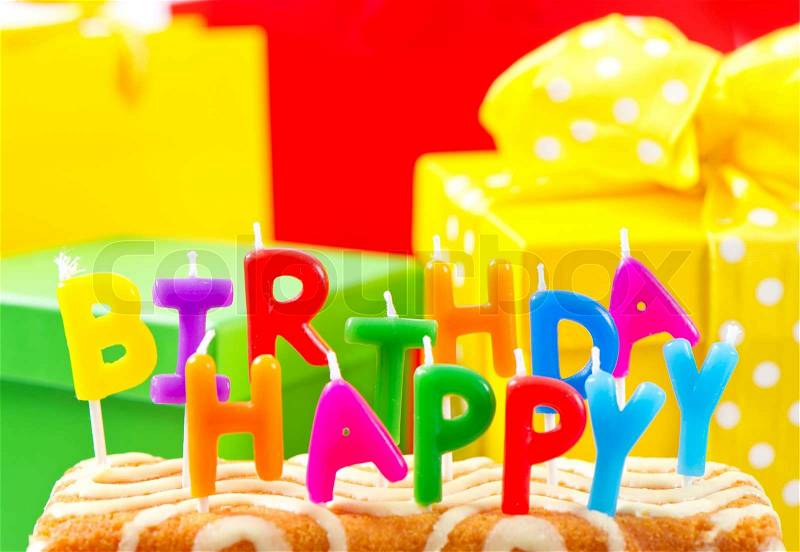 Happy Birthday! cake with multicolored candles, stock photo