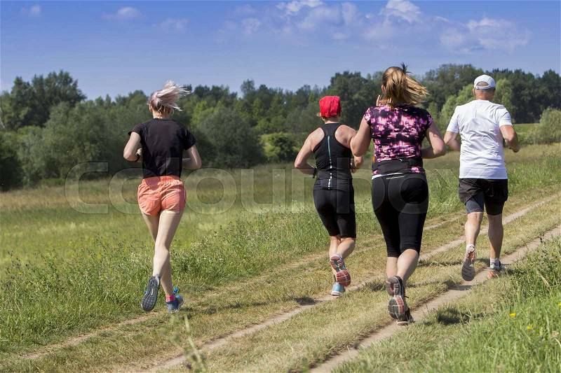 Outdoor cross-country running, Group of active people running in nature. , stock photo