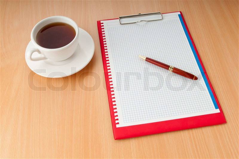 Binder with blank page and tea, stock photo