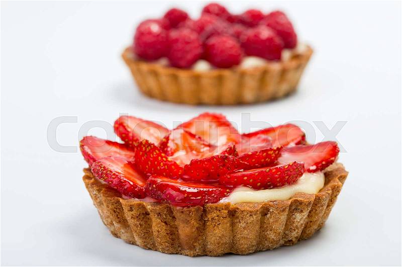 Two Fresh Fruit Tarts with strawberry and raspberry. Tarts isolated on white, stock photo