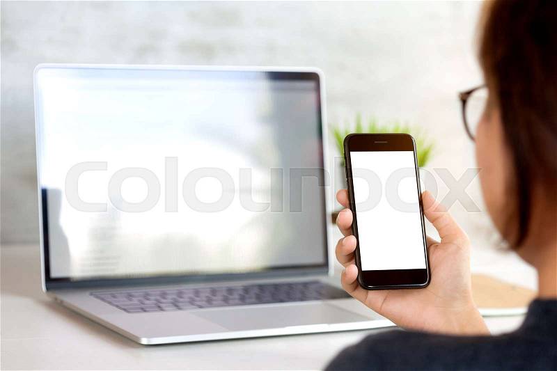 Woman holding and looking on phone mobile white screen, stock photo