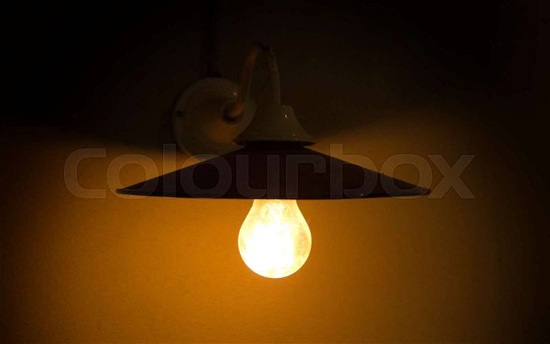 Wall light, industrial light in an old building, stock photo