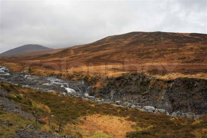 Wonderful brown toned landscape near Ullapool in Scotland with cloudy sky, stock photo
