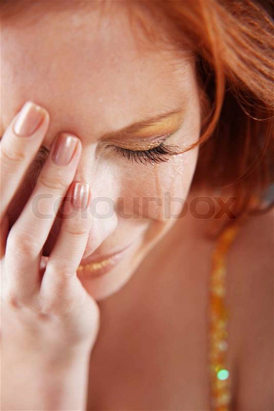 Closeup of crying woman with tears, stock photo