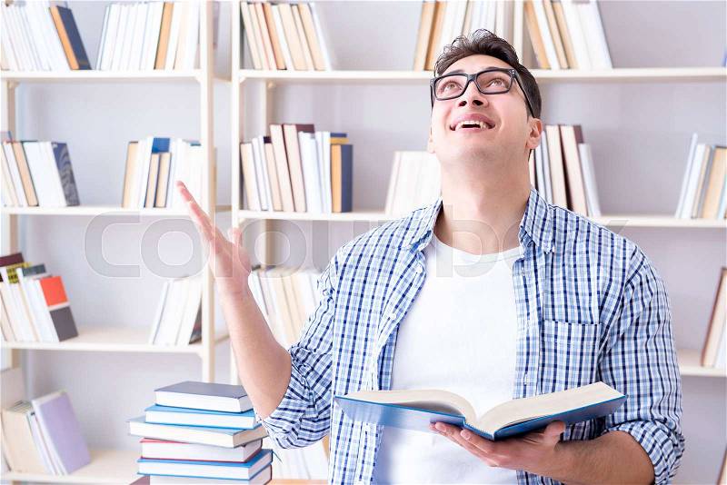 Young student with books preparing for exams, stock photo