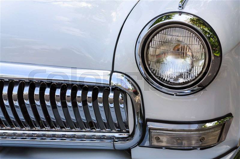 Front head light and gitter of the vintage car, stock photo