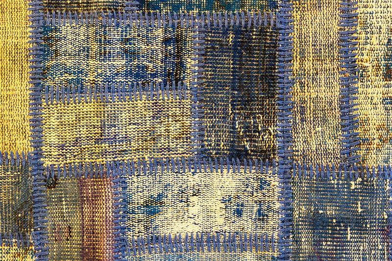 Texture of a piece of old carpet to sew thick threads, stock photo