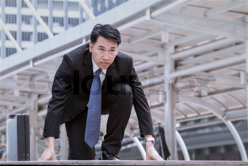 Asian Businessman wearing glasses start, and determined to start now or ready for the start, stock photo