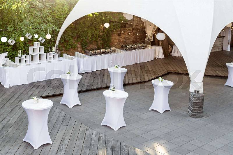 Catering services in restaurant. Wedding table reception on wedding ceremony in the park, stock photo