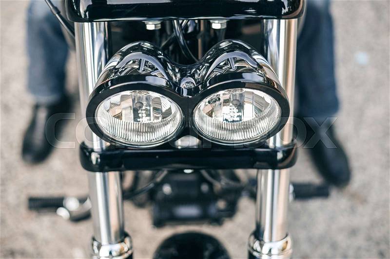 Top view of a motorcycle headlight. Motorcycle detail closeup, stock photo