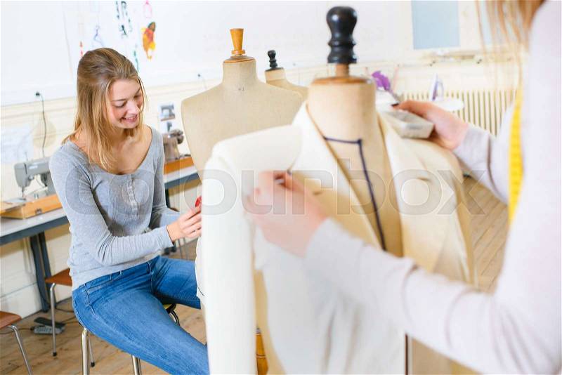 Beautiful young woman studying fashion and design, stock photo