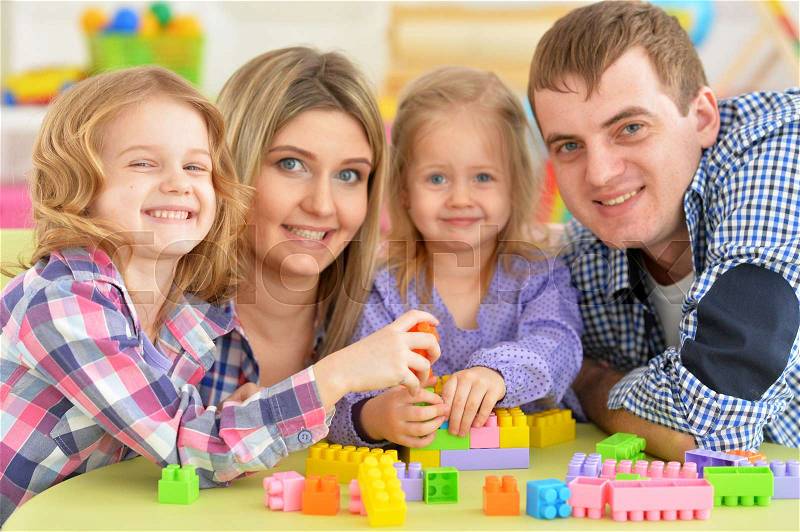 Portrait of a friendly happy family playing together, stock photo