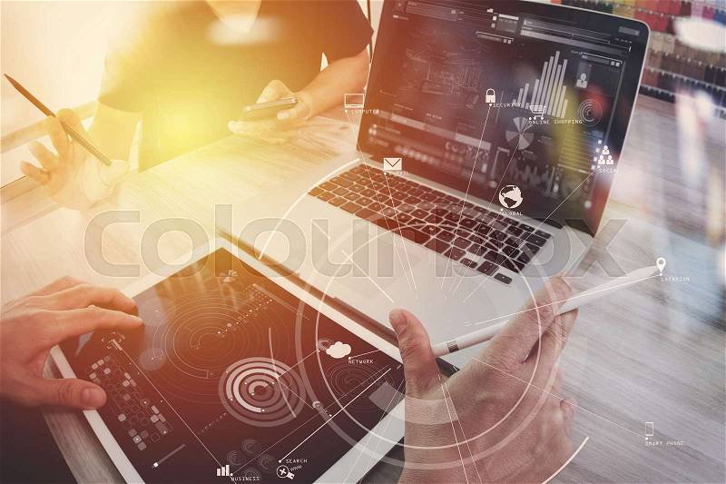 Co working team meeting concept,businessman using mobile phone and digital tablet and laptop computer in modern office with virtual icon diagram , stock photo