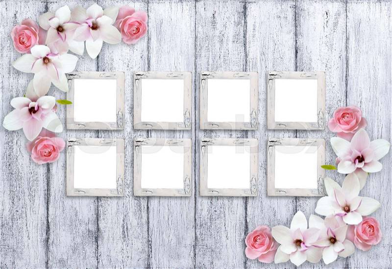 Eight retro empty photo frames with magnolia flowers and roses on background of shabby wooden planks in rustic style, stock photo