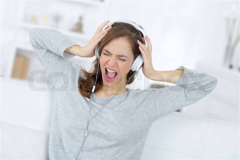 Woman music fan shouting loud, stock photo
