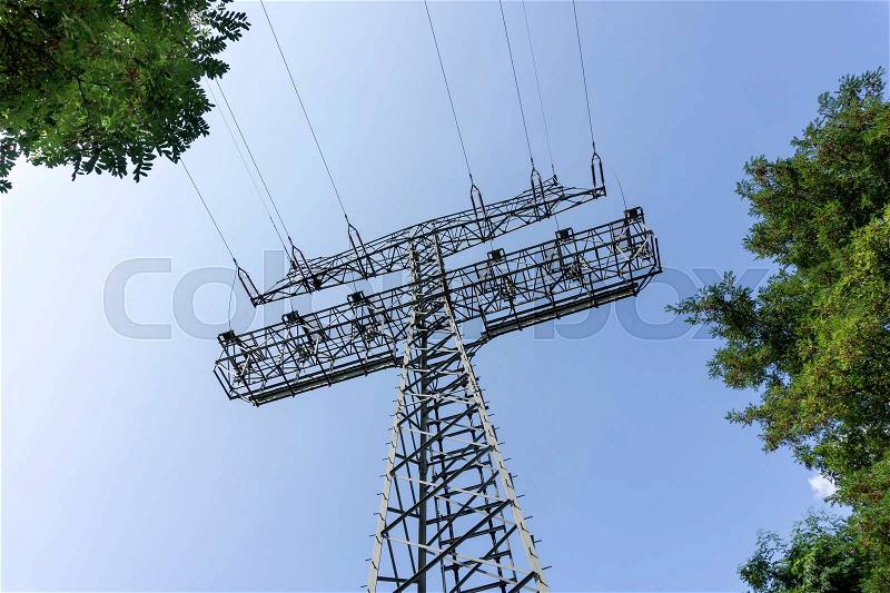 High voltage tower and cable line in the sky, stock photo