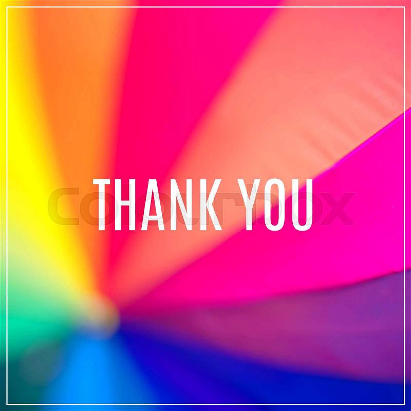 Word Thank You. Rainbow coloured umbrella, stock photo