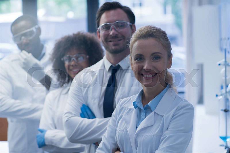 Mix Race Scientists Team Happy Smiling Working In Laboratory Doing Research, Man And Woman Making Scientific Experiments Doctors In Lab, stock photo
