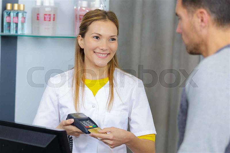 Paying with card, stock photo