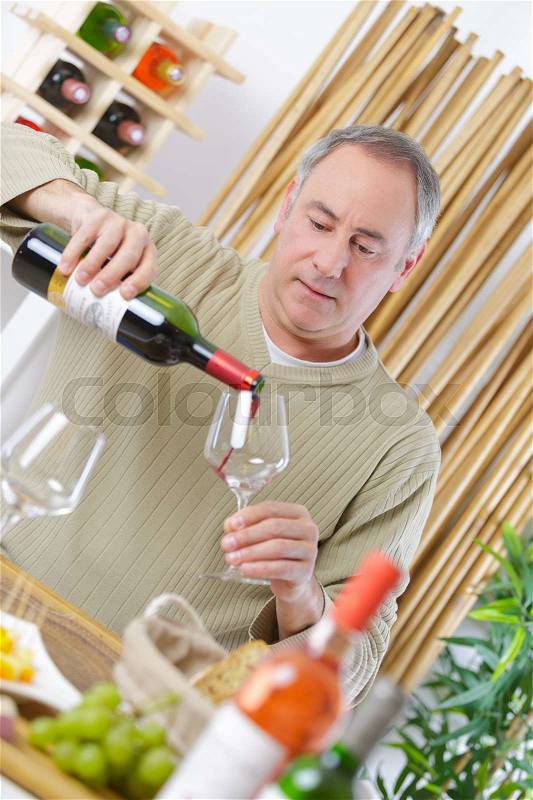 Happy man with wine glass, stock photo