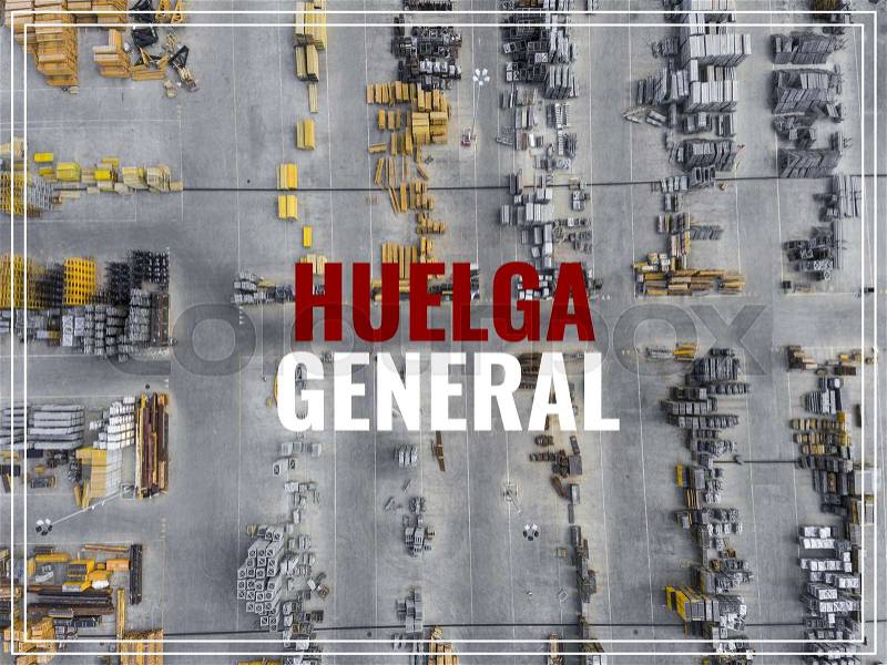 Word Huelga in spanish language. Industrial storage place, view from above, stock photo