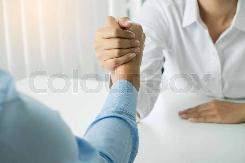 Two clasped hands of businessmen, stock photo