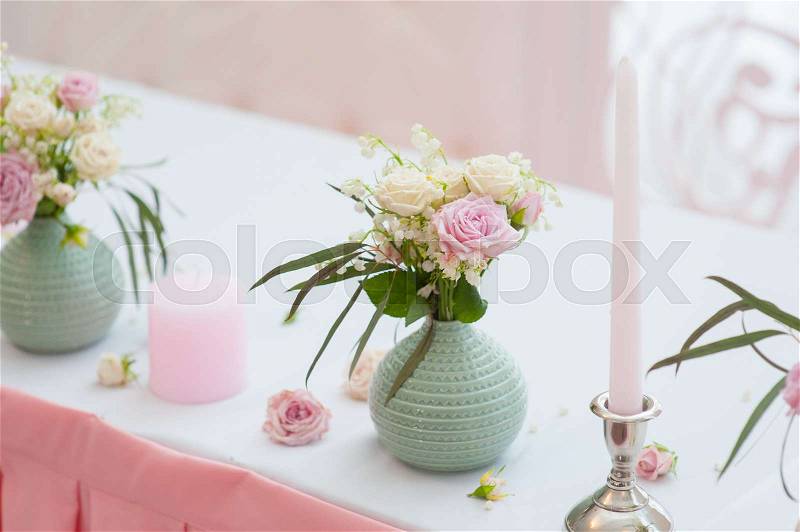 Wedding festive decor. Bouquet from spring flowers. Table layout. Table of newly married. Restaurant interior, stock photo