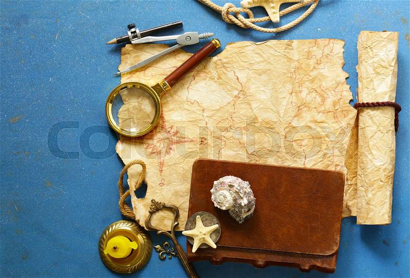 Vintage map, compass, magnifier - adventure and treasure hunt, stock photo
