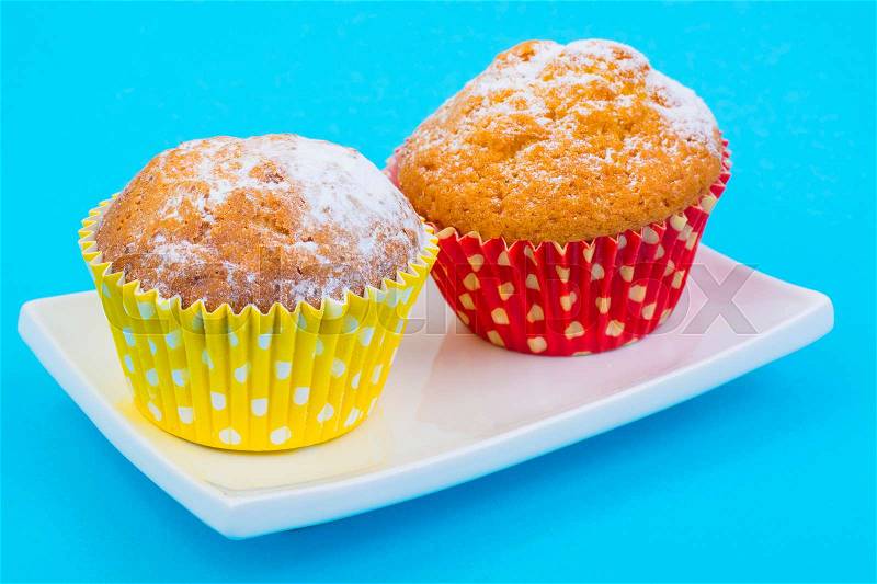 Tasty muffins on pastel background. Minimal food concept. Studio Photo, stock photo