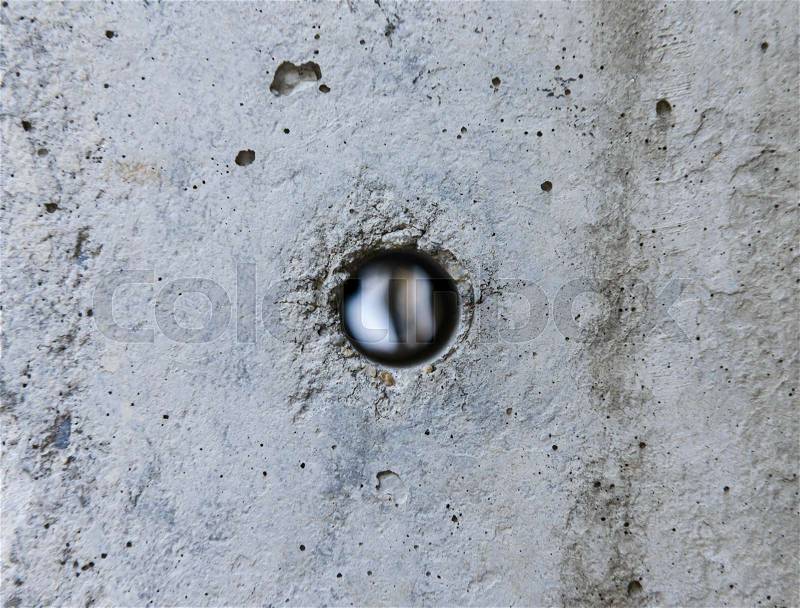 Hole in the concrete from electricity post, stock photo