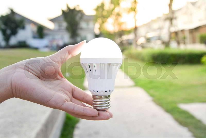 LED Bulb - saving technology in our hand, stock photo