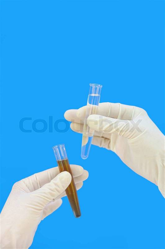 Clean and dirty water samples in hands, stock photo