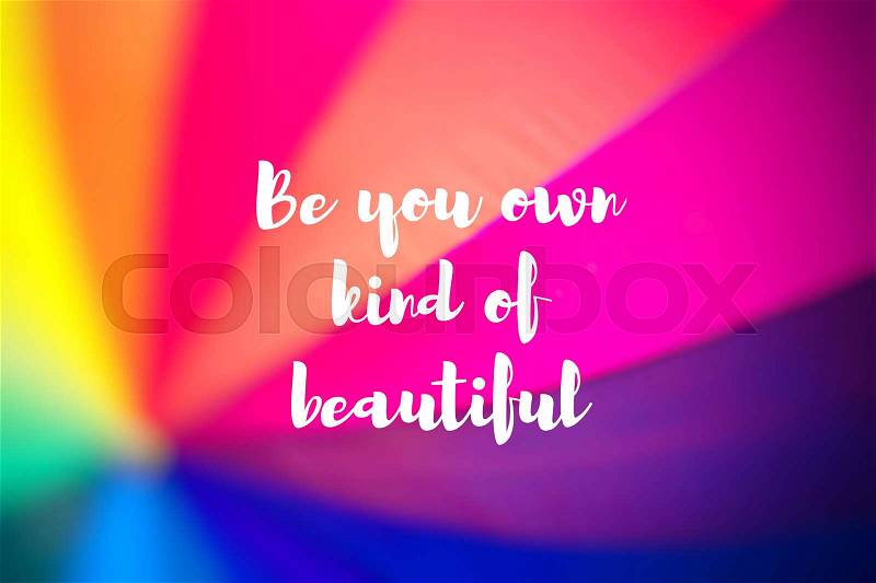 Be you own kind of beautiful. Rainbow coloured umbrella, stock photo