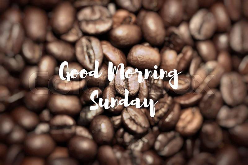 Good Morning Sunday. Closeup of coffee beans background, stock photo