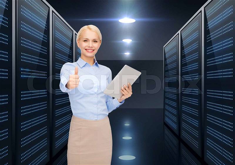 Business, people and technology concept - happy smiling businesswoman holding tablet pc computer over futuristic server room background, stock photo