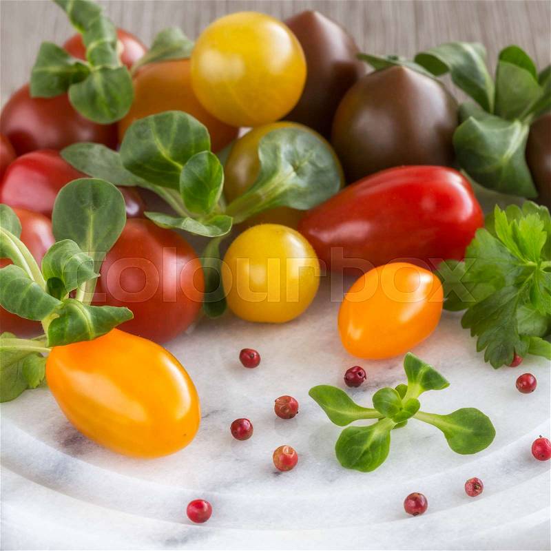 Cherry tomatoes and Peruvian pepper, close-up, stock photo
