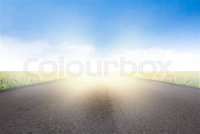 Start road on field a background of the blue sky, stock photo
