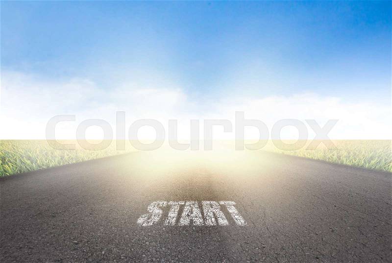 Start road on field a background of the blue sky, stock photo