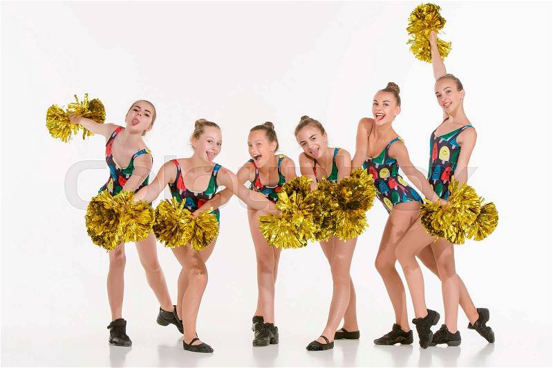 The group of teen cheerleaders posing at studio over white, stock photo
