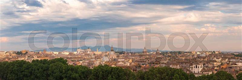Panoramic aerial wonderful view of Rome with Altar of the Fatherland and churches at sunset time in Rome, Italy, stock photo