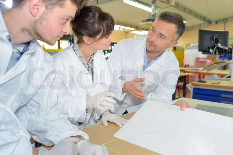 Engineering students working in the lab, stock photo