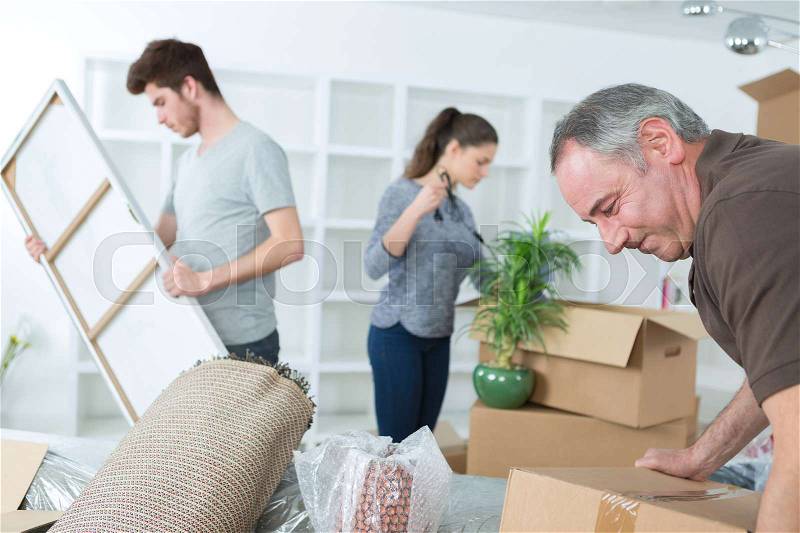 Family moving into a new house, stock photo
