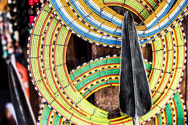 Tnational african handmade colorful decorations and tribal spear on Zanzibar market, stock photo