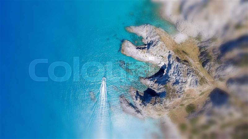 Overhead view of beautiful rocks over crystal clear ocean, stock photo