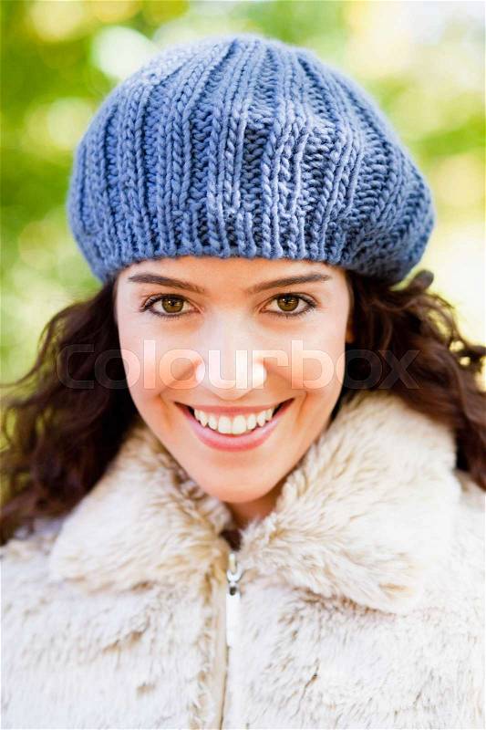 Young woman with cap portrait, stock photo