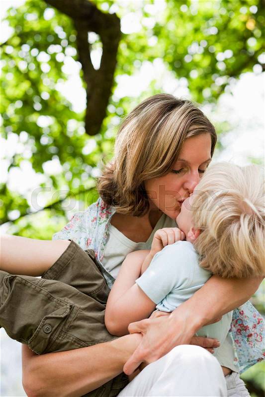 Mother Kissing Son, stock photo