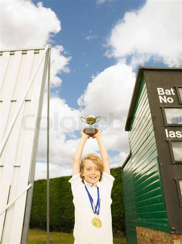 Boy with Trophy and medals, stock photo