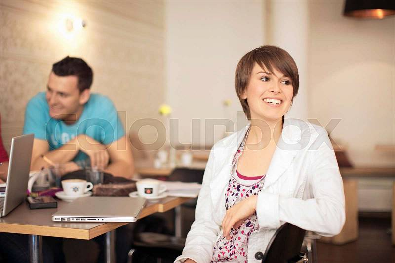 Students studying in a cafe, stock photo