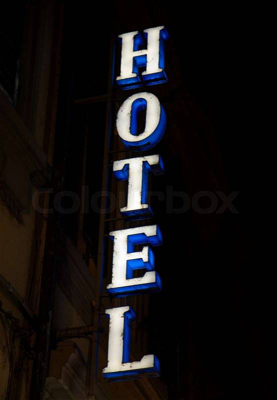 Neon Hotel sign at night, stock photo