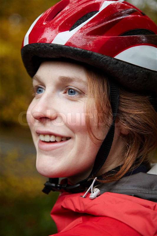 Close up of girl wearing cycle helmet, stock photo